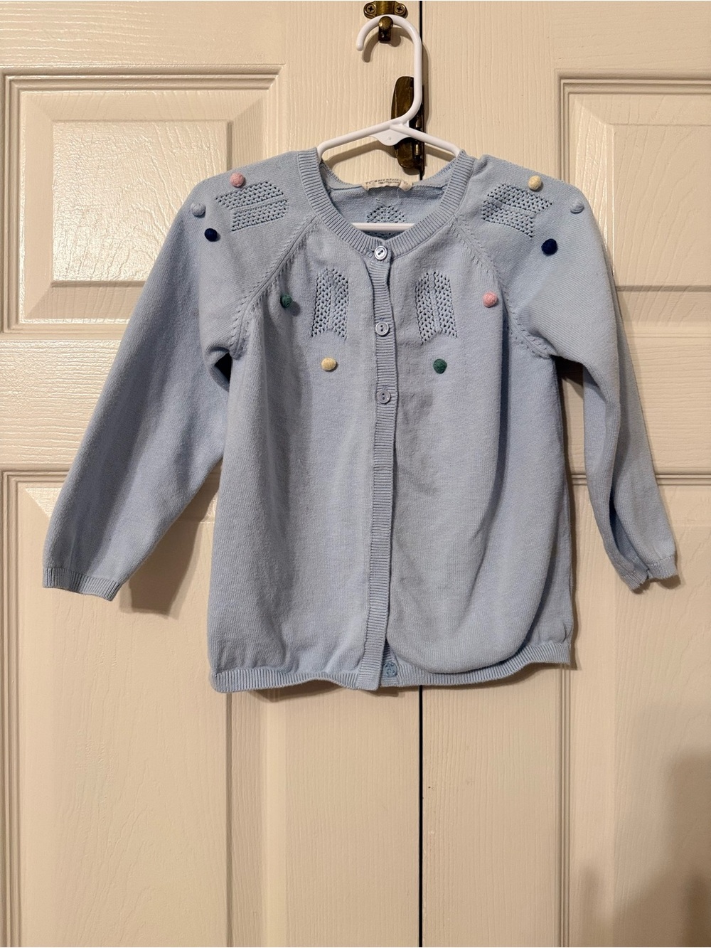 Light Blue Knit Cardigan with Pom-Pom Accents for Girls